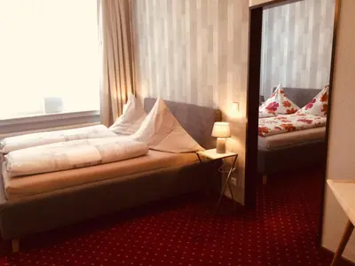 Ein Bett oder Betten in einem Zimmer der Unterkunft Gästehaus Albers