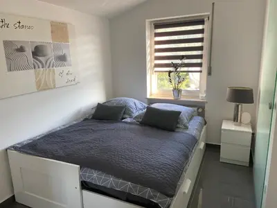 Ein Bett oder Betten in einem Zimmer der Unterkunft Ferienwohnung Schieferpfad