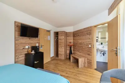 Ein Bett oder Betten in einem Zimmer der Unterkunft Hotel Berghof
