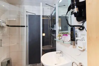 Ein Badezimmer in der Unterkunft Hotel Berghof