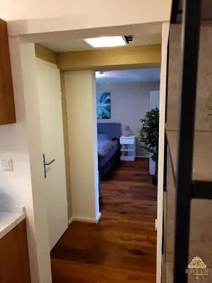 Ein Bett oder Betten in einem Zimmer der Unterkunft Ruhiges Studio I Nähe WHU I WLAN