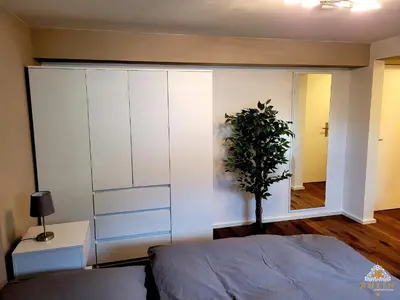 Ein Bett oder Betten in einem Zimmer der Unterkunft Ruhiges Studio I Nähe WHU I WLAN
