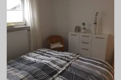 Ein Bett oder Betten in einem Zimmer der Unterkunft Ferienwohnung Forneck am Rheingoldbogen