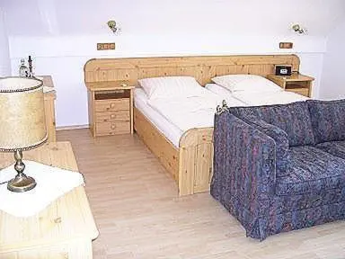 Ein Bett oder Betten in einem Zimmer der Unterkunft Landhotel Niederthäler Hof
