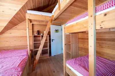 Ein Bett oder Betten in einem Zimmer der Unterkunft Glaadter Hütte