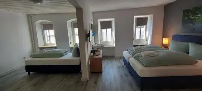 Ein Bett oder Betten in einem Zimmer der Unterkunft Pension am Lieserpfad