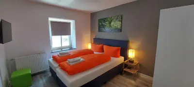 Ein Bett oder Betten in einem Zimmer der Unterkunft Pension am Lieserpfad