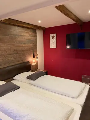 Ein Bett oder Betten in einem Zimmer der Unterkunft Landgasthaus Alter Posthof