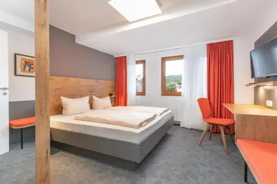 Ein Bett oder Betten in einem Zimmer der Unterkunft Parkhotel Cochem- Free Parking -