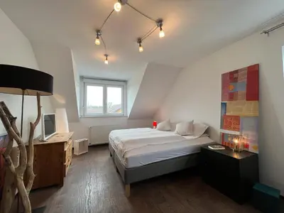 Ein Bett oder Betten in einem Zimmer der Unterkunft Zum schönen Ausblick