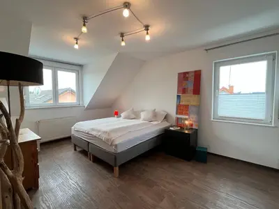 Ein Bett oder Betten in einem Zimmer der Unterkunft Zum schönen Ausblick