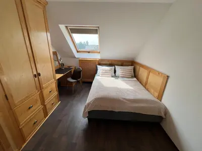 Ein Bett oder Betten in einem Zimmer der Unterkunft Zum schönen Ausblick