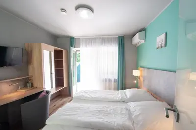 Ein Bett oder Betten in einem Zimmer der Unterkunft Hotel Blüchertal