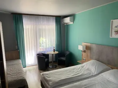 Ein Bett oder Betten in einem Zimmer der Unterkunft Hotel Blüchertal