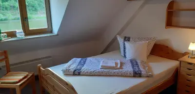 Ein Bett oder Betten in einem Zimmer der Unterkunft Altes Weingut Bröhl