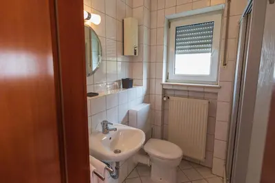 Ein Badezimmer in der Unterkunft Haus Flora - Ferienwohnungen