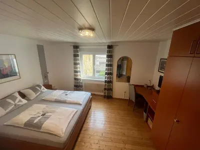 Ein Bett oder Betten in einem Zimmer der Unterkunft Wein- und Gästehaus M. Bai