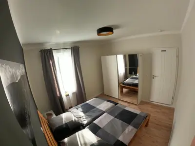 Ein Bett oder Betten in einem Zimmer der Unterkunft Ferienwohnung Südkurve