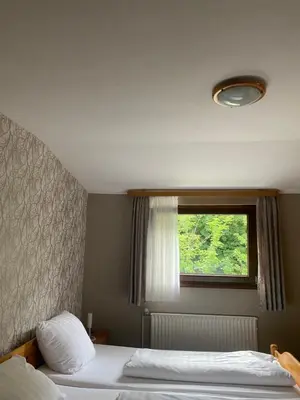 Ein Bett oder Betten in einem Zimmer der Unterkunft Rheingoldschänke