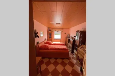 Ein Bett oder Betten in einem Zimmer der Unterkunft Ferienhaus Wilhelm mitten im Hunsrück