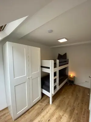 Ein Bett oder Betten in einem Zimmer der Unterkunft Ferienwohnungen am Wasserfall