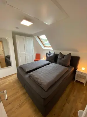 Ein Bett oder Betten in einem Zimmer der Unterkunft Ferienwohnungen am Wasserfall
