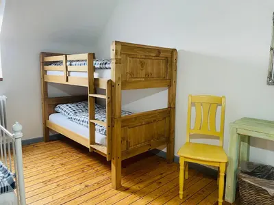 Ein Bett oder Betten in einem Zimmer der Unterkunft Ferienhaus Backesgarten für 22 Personen