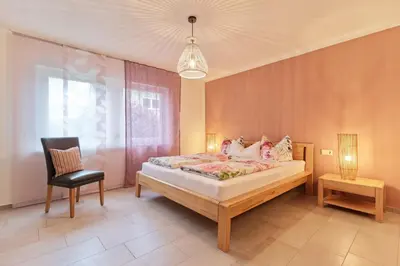Ein Bett oder Betten in einem Zimmer der Unterkunft Ferienwohnungen Weingut und Vinothek Regnery