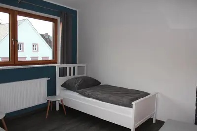 Ein Bett oder Betten in einem Zimmer der Unterkunft FeWo Krämer