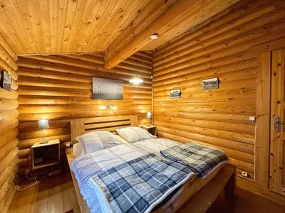 Ein Bett oder Betten in einem Zimmer der Unterkunft Chalet Birdieferienhaus by Interhome