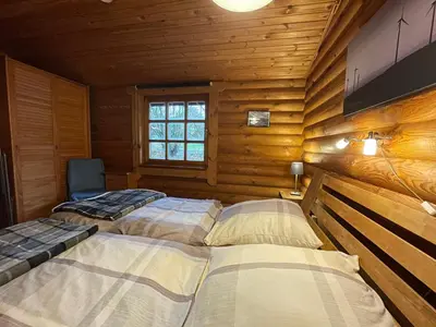 Ein Bett oder Betten in einem Zimmer der Unterkunft Chalet Birdieferienhaus by Interhome
