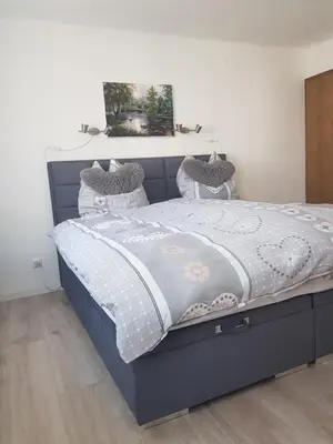 Ein Bett oder Betten in einem Zimmer der Unterkunft Mosel-Ina