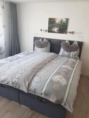 Ein Bett oder Betten in einem Zimmer der Unterkunft Mosel-Ina