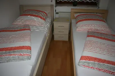 Ein Bett oder Betten in einem Zimmer der Unterkunft Haus Lahntalblick
