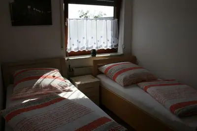 Ein Bett oder Betten in einem Zimmer der Unterkunft Haus Lahntalblick