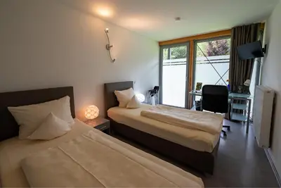 Ein Bett oder Betten in einem Zimmer der Unterkunft Hotel Vicinity