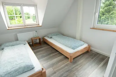 Ein Bett oder Betten in einem Zimmer der Unterkunft Ferienwohnung Träwa
