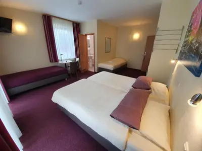 Ein Bett oder Betten in einem Zimmer der Unterkunft Hotel Bergschlösschen