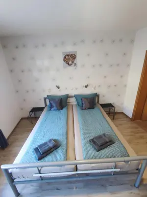 Ein Bett oder Betten in einem Zimmer der Unterkunft Mosel Restaurant & Weinstube Zum Anker