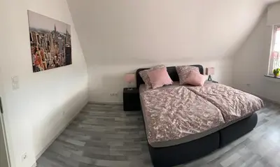 Ein Bett oder Betten in einem Zimmer der Unterkunft Erica Ferienwohnung auf dem Traumpfad