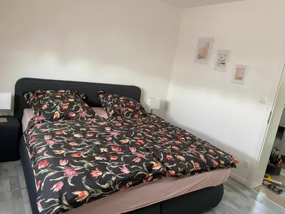 Ein Bett oder Betten in einem Zimmer der Unterkunft Erica Ferienwohnung auf dem Traumpfad