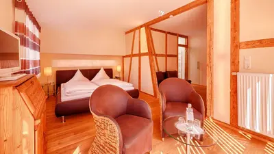 Ein Bett oder Betten in einem Zimmer der Unterkunft Hotel Weinberg-Schlößchen