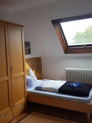 Ein Bett oder Betten in einem Zimmer der Unterkunft Pension Hermes