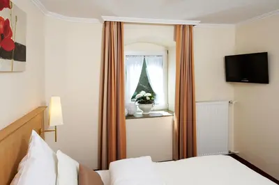 Ein Bett oder Betten in einem Zimmer der Unterkunft Landhotel Krolik