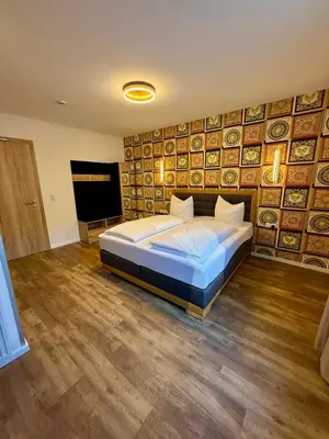 Ein Bett oder Betten in einem Zimmer der Unterkunft Hotel Restaurant Unikat