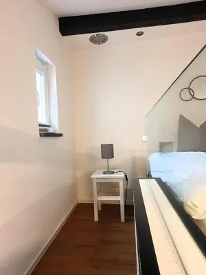 Ein Bett oder Betten in einem Zimmer der Unterkunft Ferienapartment Rebwinkel