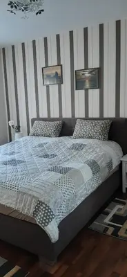 Ein Bett oder Betten in einem Zimmer der Unterkunft Ferienwohnung Wilfried