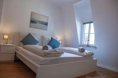 Ein Bett oder Betten in einem Zimmer der Unterkunft Suite Cuveé Zell