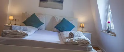 Ein Bett oder Betten in einem Zimmer der Unterkunft Suite Cuveé Zell