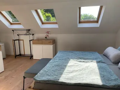 Ein Bett oder Betten in einem Zimmer der Unterkunft Ferienwohnung zum Mandelgraben